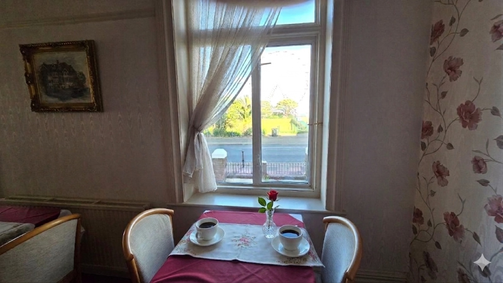 Atlantis Lounge — intimate table for two with sea view and fresh flowers