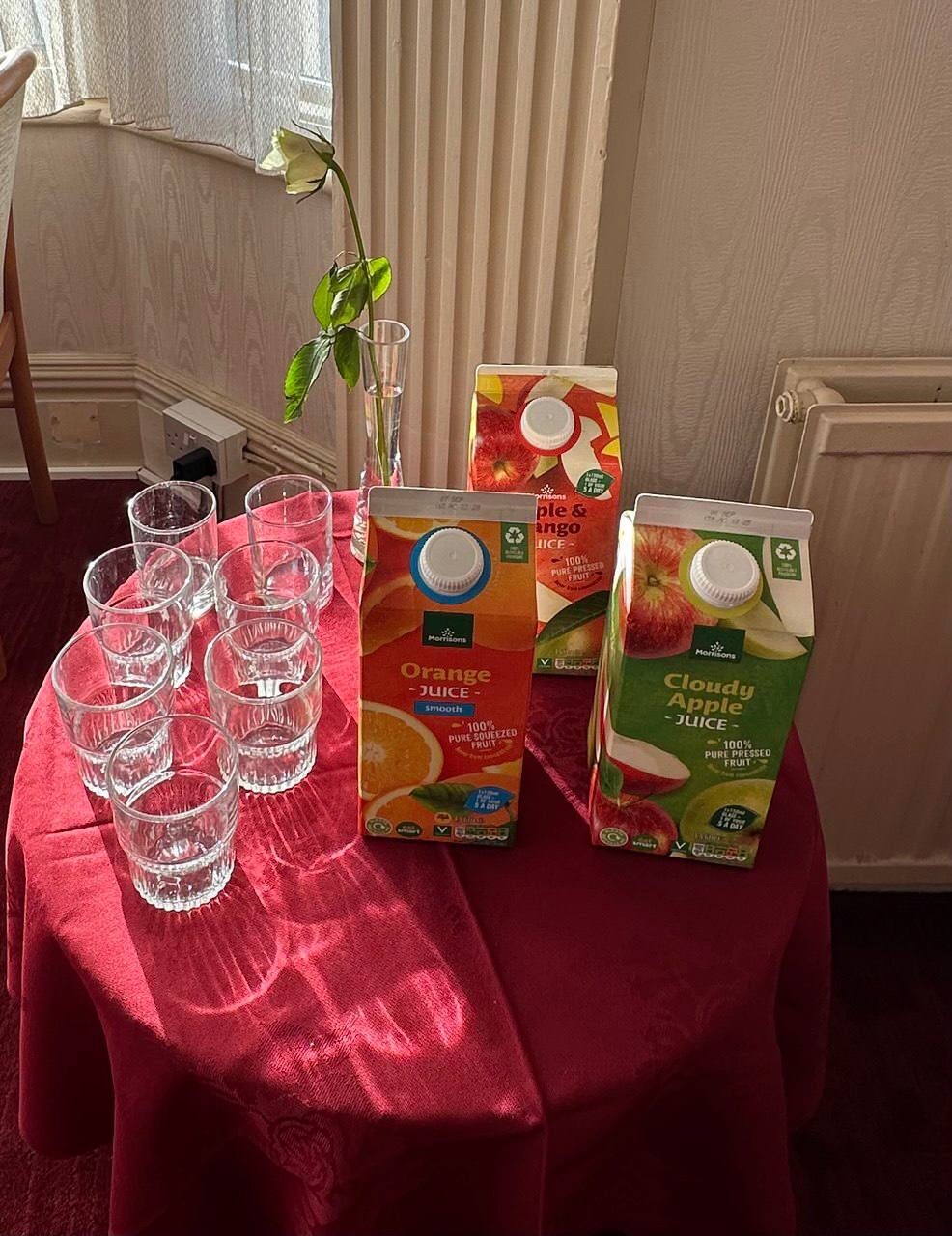 Freshly pressed juices at breakfast — orange, cloudy apple and apple & mango