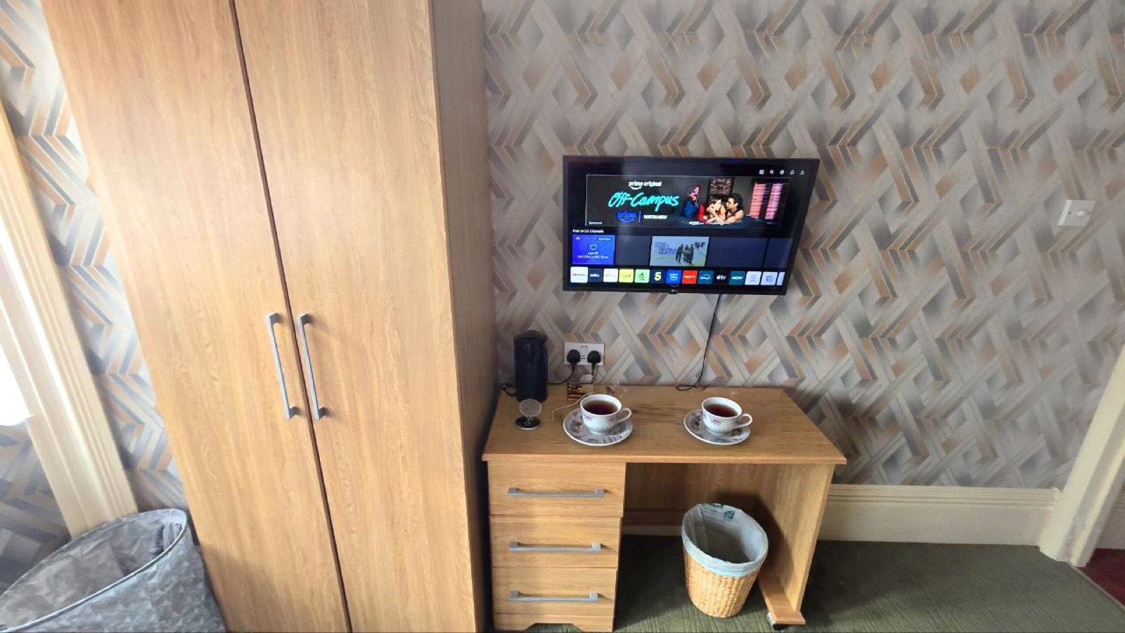 Room 1 · Jade — desk with TV, kettle and tea tray
