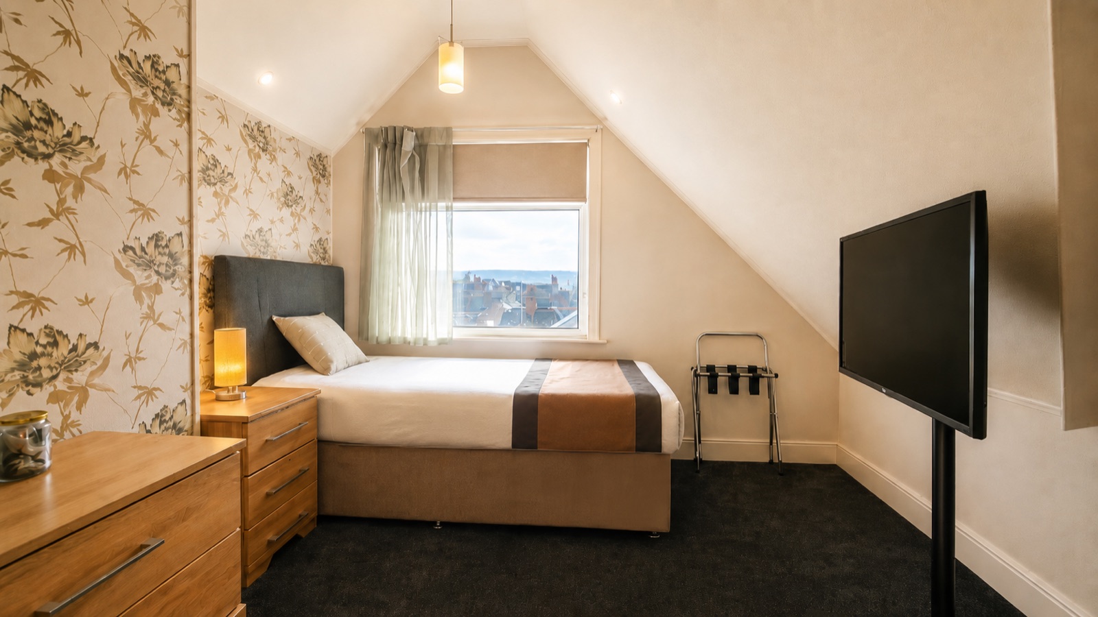Citrine room — single bed with citrine bedside lamp